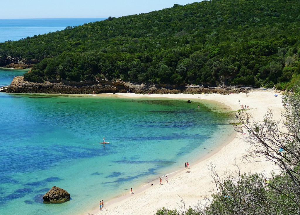 Indulge in the beauty of Setúbal's stunning coastline, from vibrant Praia da Saúde to serene Praia de Galapinhos, on a day trip from Lisbon.