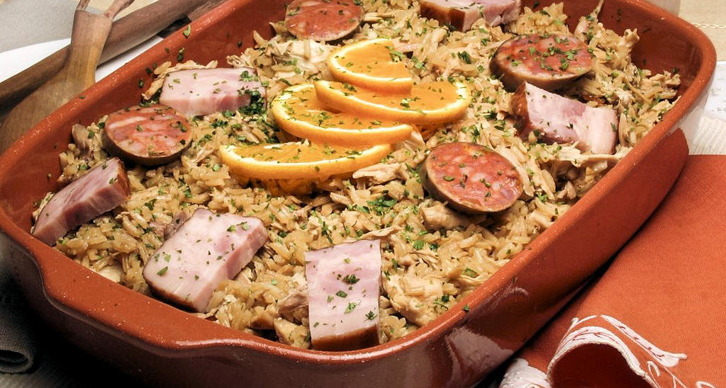 Arroz de Pato: Portugal's culinary gem combining tender duck, creamy rice, and smoky sausages; a dish that embodies history, culture, and rich flavors.