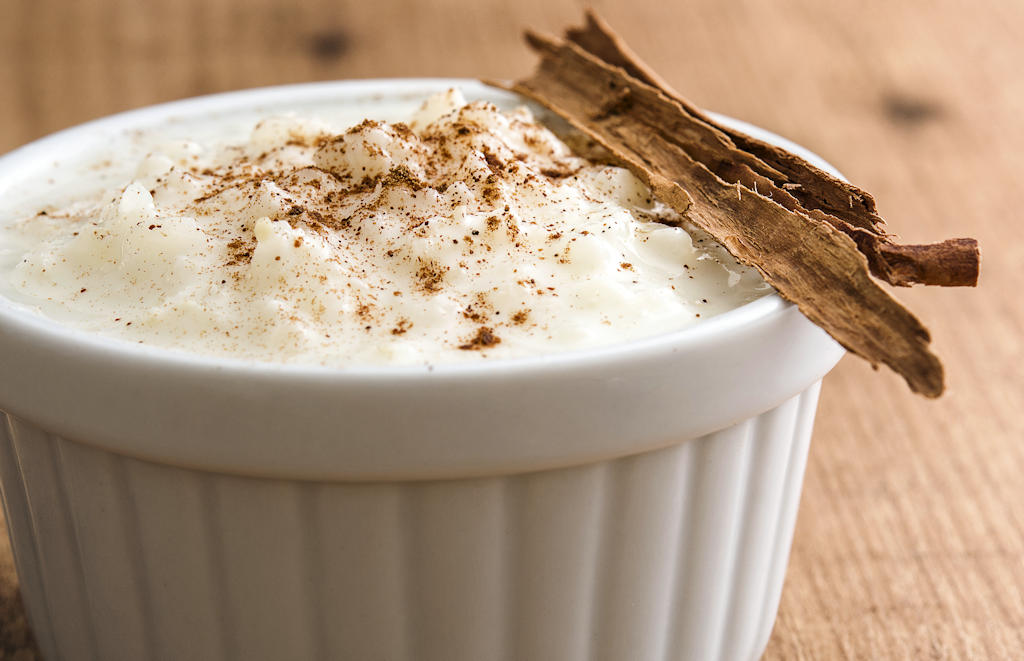 Experience the creamy allure of Arroz-Doce, Portugal's treasured dessert. Delight in the flavors of sweet rice, cinnamon, and lemon peel, a true culinary masterpiece.