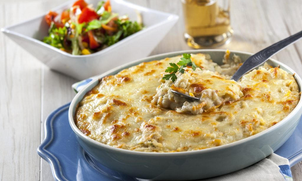 Experience the creamy goodness of Bacalhau Espiritual, a beloved Portuguese dish featuring salted cod in a velvety bechamel sauce, embodying the rich culinary heritage of Portugal.