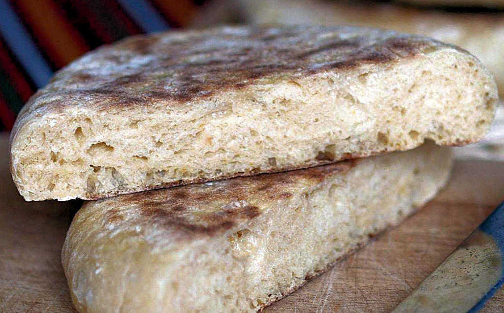 Experience the authentic flavors of Madeira with Bolo do Caco, a traditional bread that combines history, taste, and versatility in every bite.