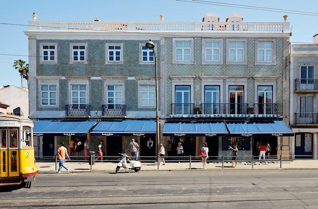 Indulge in the iconic Portuguese custard tarts at Pastéis de Belém bakery in Lisbon's Belém district and experience a culinary delight that has captivated hearts for generations.