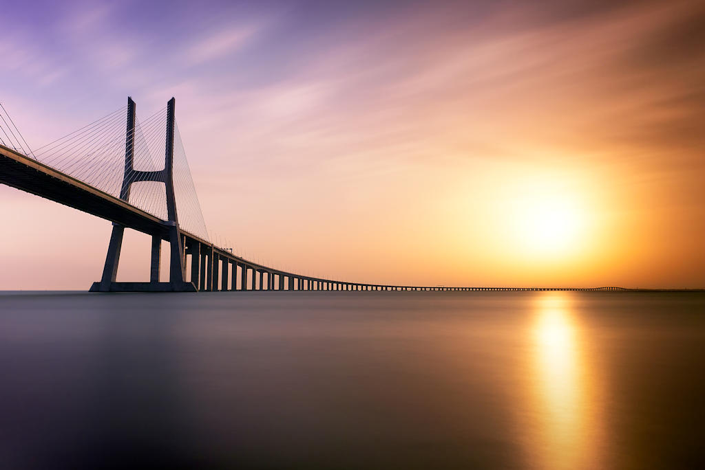 Discover the architectural marvel of Vasco da Gama Bridge, Europe's longest bridge connecting Lisbon, showcasing Portugal's engineering prowess.